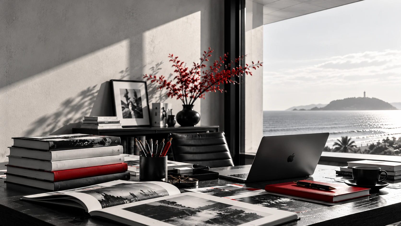 An editorial workspace overlooking the Shonan coast, with red flowers.